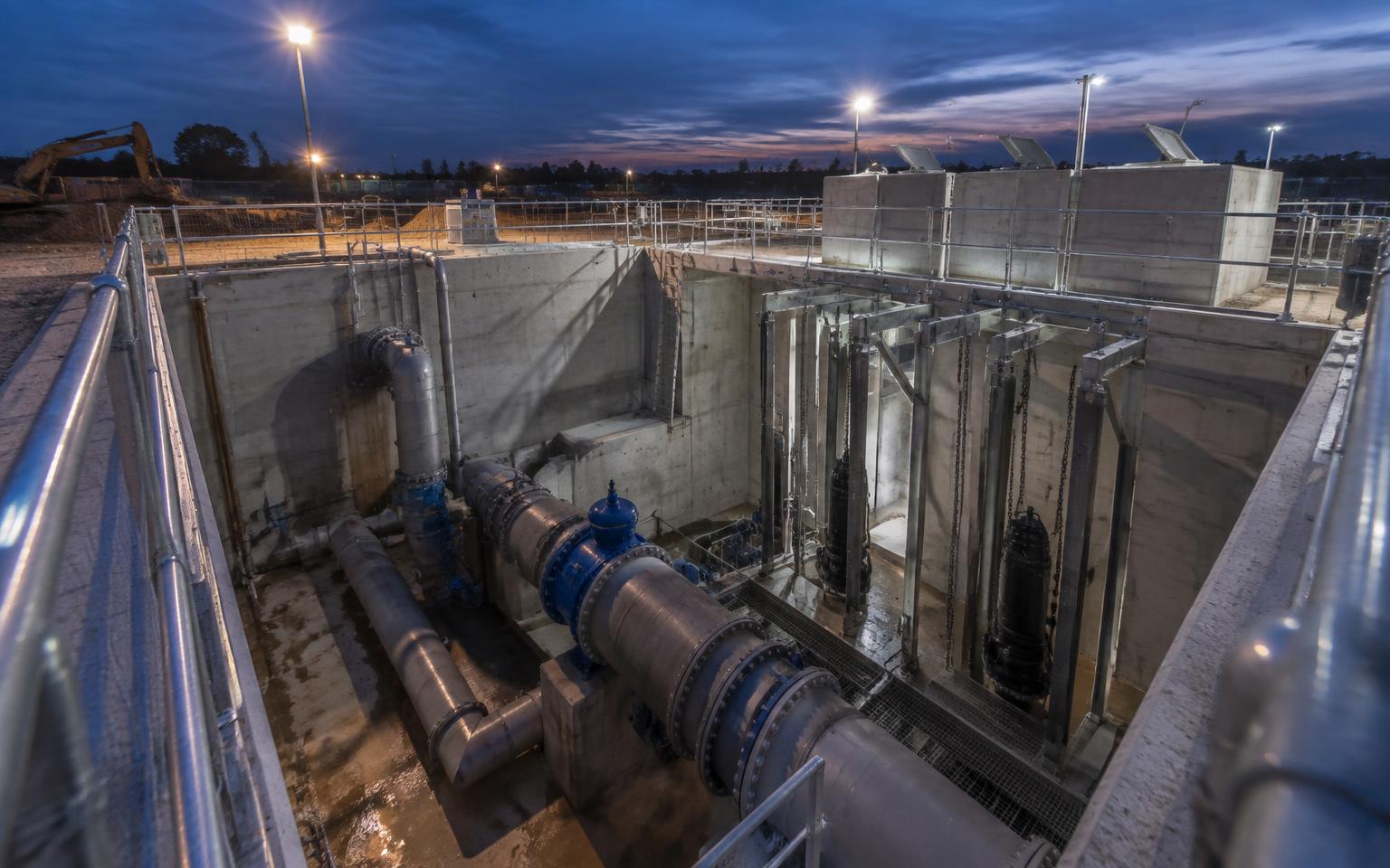 Concrete pumping station structure with pipework and valves